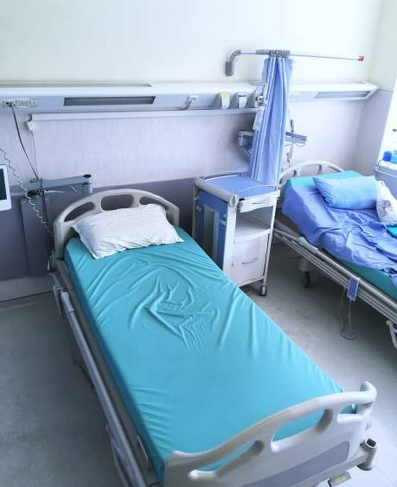 Close up view of a bed in a hospital room. Close up view of a bed in a hospital room.